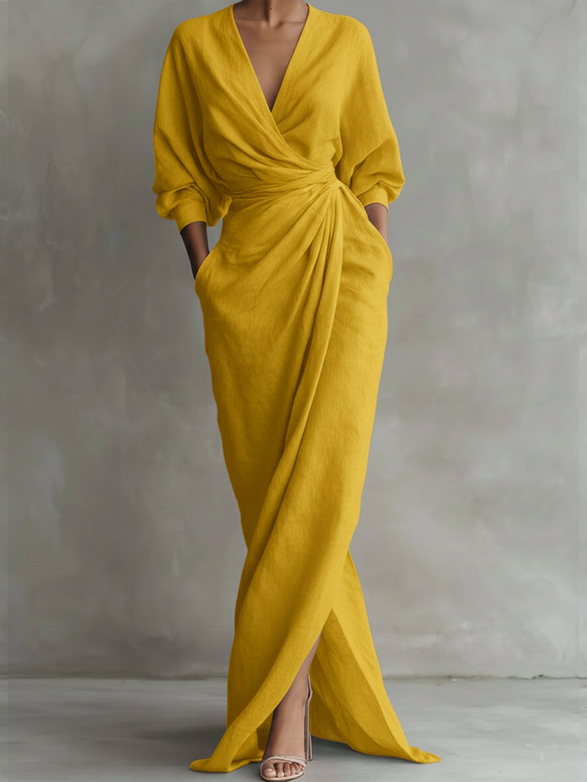 White V neck wrap waist long sleeve maxi dress by FJØRNA, flowing fabric, elegant design, and full-length style.