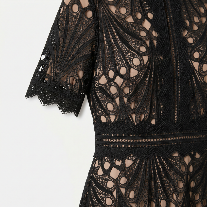 Women's elegant lace midi dress by FJØRNA featuring a high neck, refined cutwork detail, and a sophisticated silhouette.
