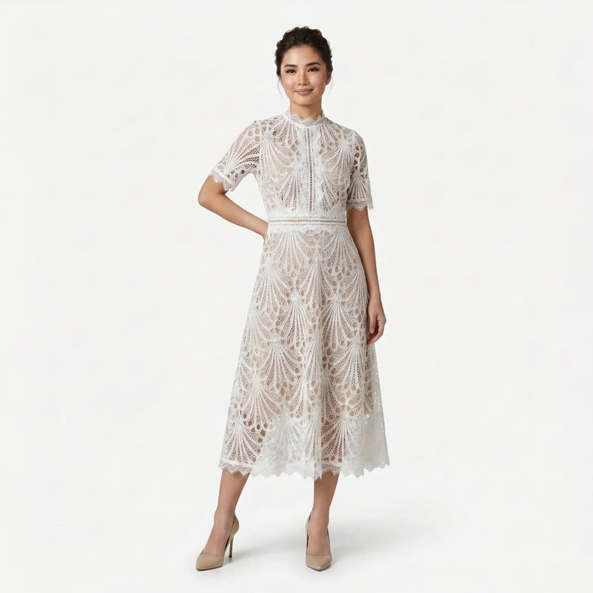 Women's elegant lace midi dress by FJØRNA featuring high neck, refined cutwork detail, and a sophisticated silhouette.