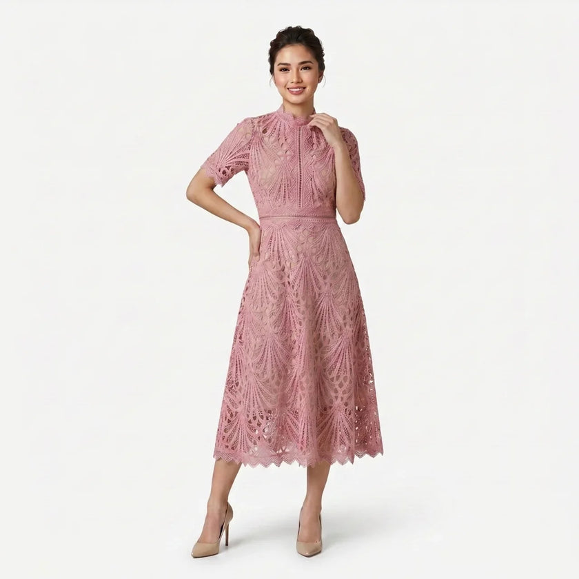 Women's elegant lace midi dress by FJØRNA featuring a high neck silhouette and intricate cutwork detail.