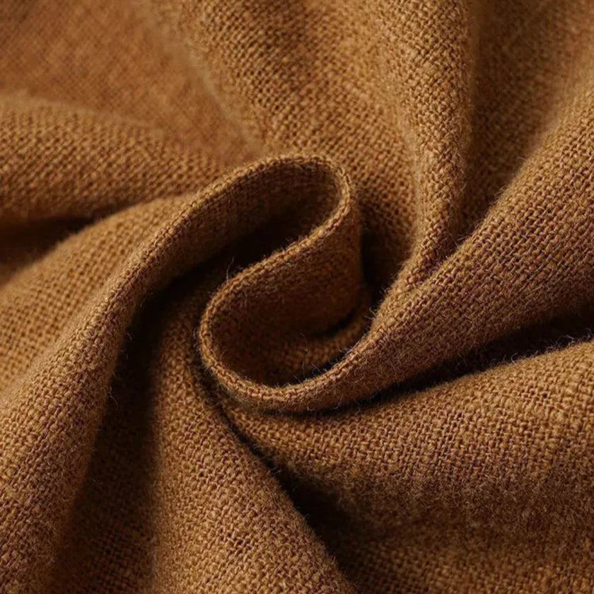 FJØRNA men's cotton linen trousers with drawstring, relaxed fit, in a casual cafe color, showing the comfortable waistband and fabric details.