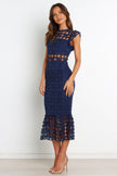 Navy midi dress from FJØRNA's Lauren collection featuring a flowy petal and pup floral print.