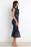 FJØRNA Lauren Navy Midi Dress featuring a flowy petal design and elegant silhouette, perfect for stylish occasions.