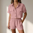 Pink FJØRNA relaxed two-piece shorts set with a collared top and matching lightweight textured woven fabric shorts.
