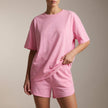 Pink women's summer two-piece drawstring co-ord set by FJØRNA, featuring a stylish matching top and shorts for warm weather.