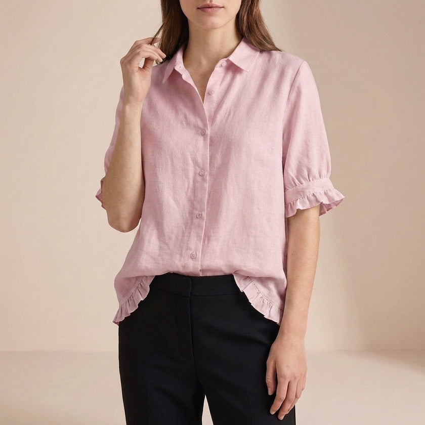 Pink denim ruffle summer blouse for women by FJØRNA, casual top with feminine details and relaxed fit.