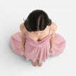 Pink FJØRNA chiffon bridesmaid dress with cowl neck and high-low hem, perfect for summer weddings and formal occasions.