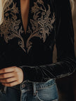 Black V-neck embroidered velvet long sleeve top by FJØRNA, featuring elegant embroidery and soft velvet fabric.
