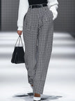 White houndstooth tailored women's straight-leg trousers by FJØRNA, shown as crisp, professional pants on a neutral background.
