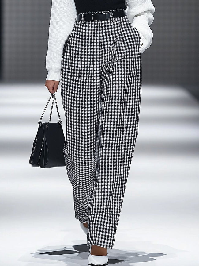 White houndstooth tailored women's straight-leg trousers by FJØRNA, shown as crisp, professional pants on a neutral background.