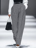 White houndstooth tailored women's straight-leg trousers by FJØRNA, shown as crisp, professional pants on a neutral background.