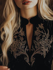 Black V-neck embroidered velvet long sleeve top by FJØRNA, featuring detailed embroidery on soft velvet fabric.