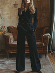 Navy corduroy double-breasted blazer and wide-leg trouser set by FJØRNA, shown as a stylish two-piece outfit.
