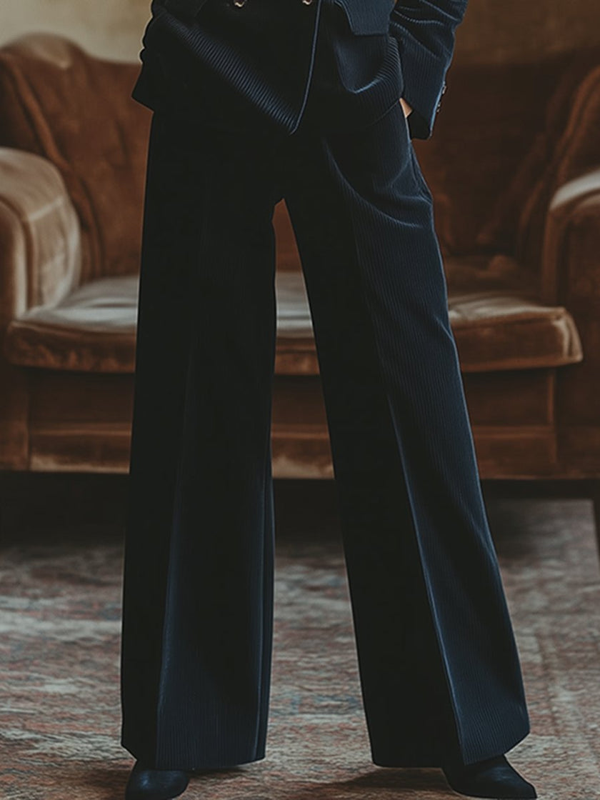 FJØRNA navy corduroy double-breasted blazer and wide-leg trouser set, stylish two-piece outfit on a hanger.
