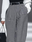 White houndstooth tailored women's straight-leg pants by FJØRNA, shown in a classic and stylish design.
