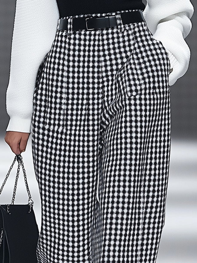 White houndstooth tailored women's straight-leg pants by FJØRNA, shown in a classic and stylish design.