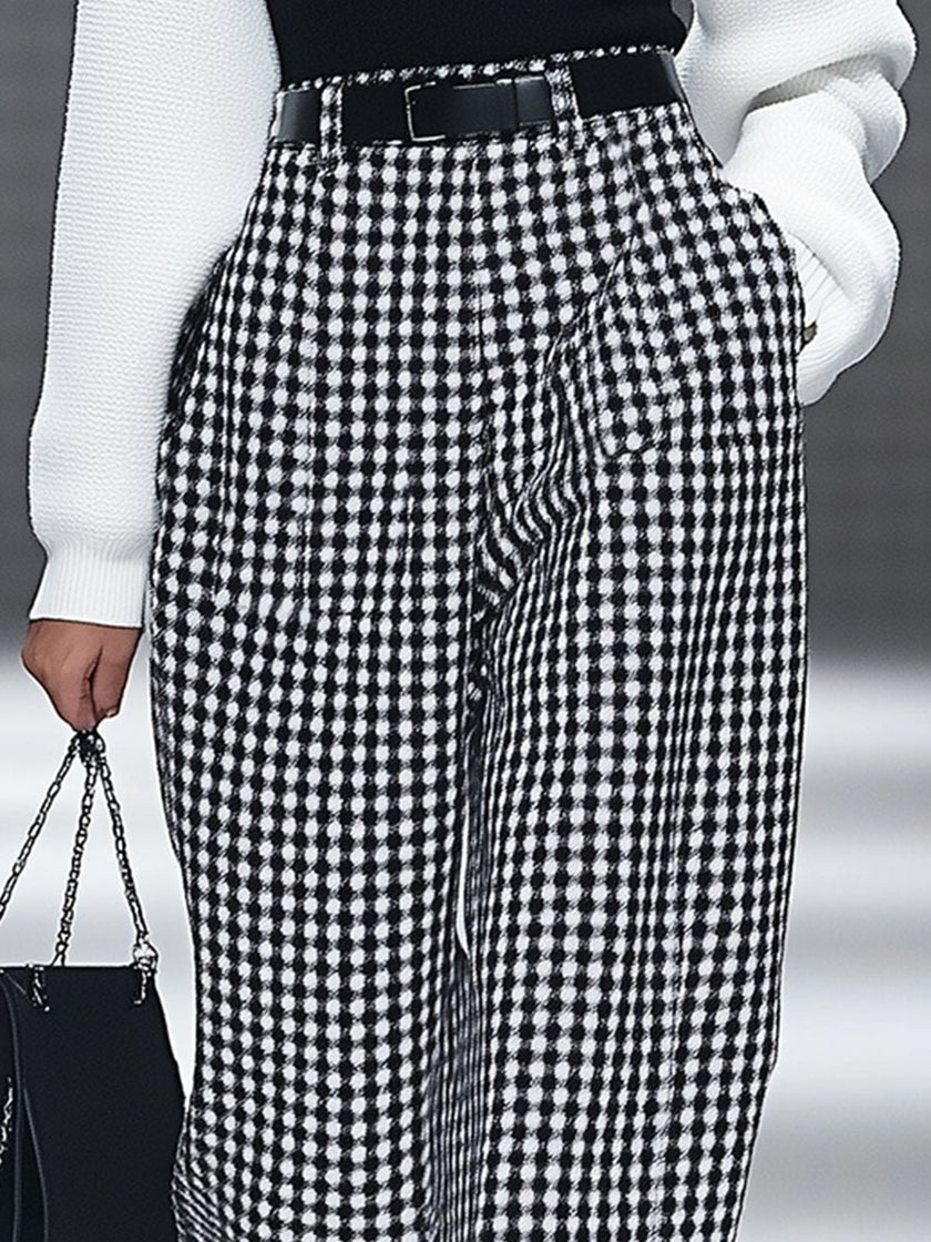 White houndstooth tailored women's straight-leg pants by FJØRNA, shown in a classic and stylish design.