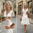 FJØRNA elegant floral midi dress for women with a V-neck, stylish and flowy for casual or dressy occasions.