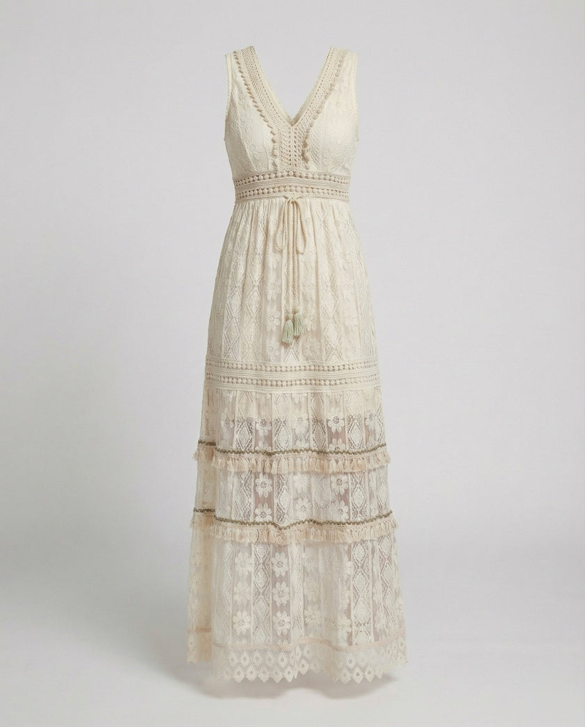 FJØRNA bohemian lace maxi dress with tiered skirt and tassel waist, flowing design for a stylish, relaxed look.