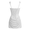 FJØRNA women's square neck ruched mini dress displayed on a hanger, showcasing its fitted silhouette and elegant design.