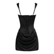 FJØRNA women's square neck ruched mini dress hanging on a hanger, showcasing its fitted bodice and stylish design.