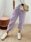 FJØRNA Holly™ striped purple pants with a relaxed fit and bold pattern, showcased on a model against a neutral background.