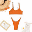 FJØRNA women's push-up bikini swimwear on a model, featuring a stylish bikini top and bottoms for beach or poolside wear.