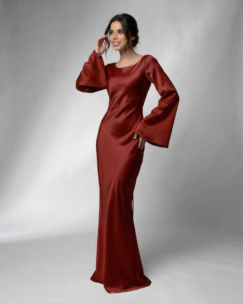 FJØRNA satin maxi dress for women with elegant bell sleeves, rich rust color, form-fitting silhouette, and luxurious fabric.