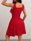 FJØRNA red and black flared fit summer dress with square neckline, back view showcasing tailored mini dress style.