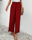 Red FJØRNA women's lightweight summer trousers with wide leg, breathable and flowy fabric, perfect for warm weather.