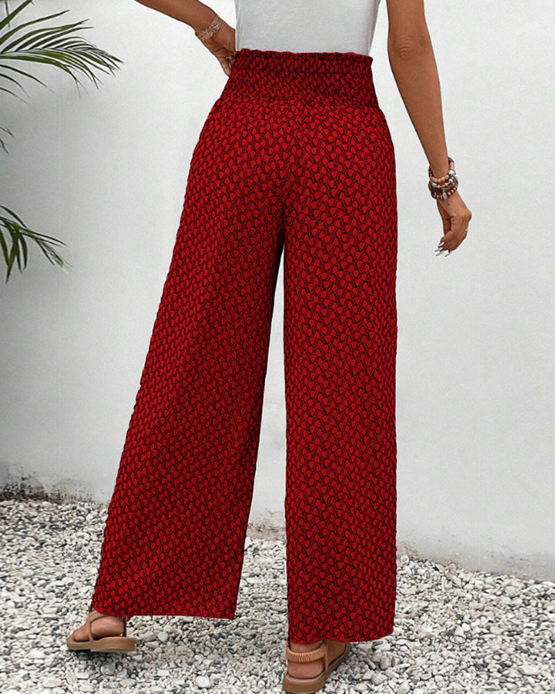 Red FJØRNA lightweight summer women's wide leg trousers, breathable flowy fabric, relaxed fit, perfect for warm weather.