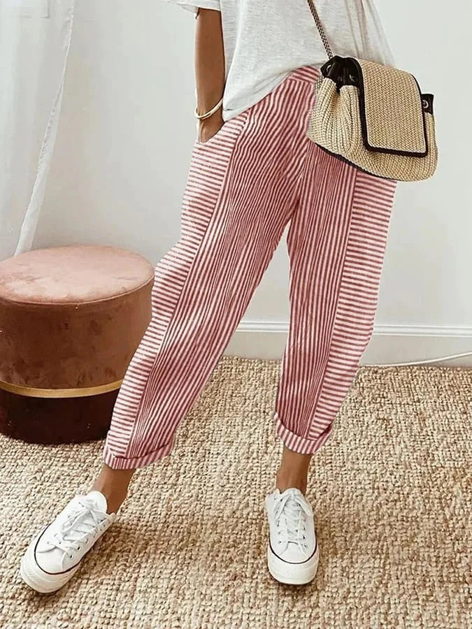 Red Holly™ striped pants by FJØRNA featuring bold horizontal stripes and a comfortable fit.