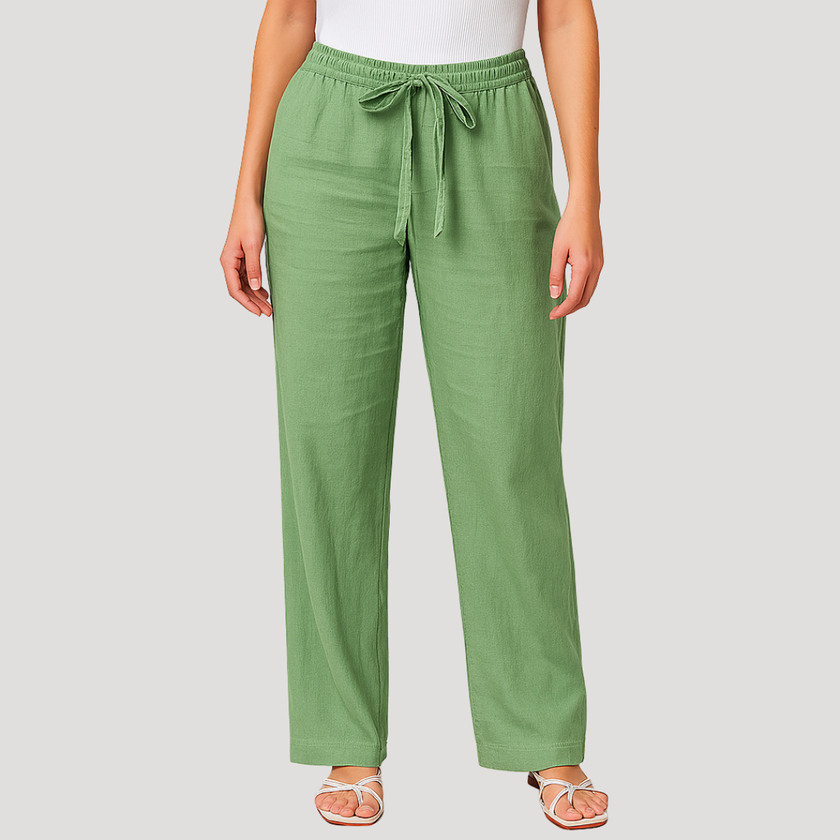 FJØRNA Reyna women's wide-leg pants with drawstring waist, relaxed fit, and lightweight fabric, shown on a model.