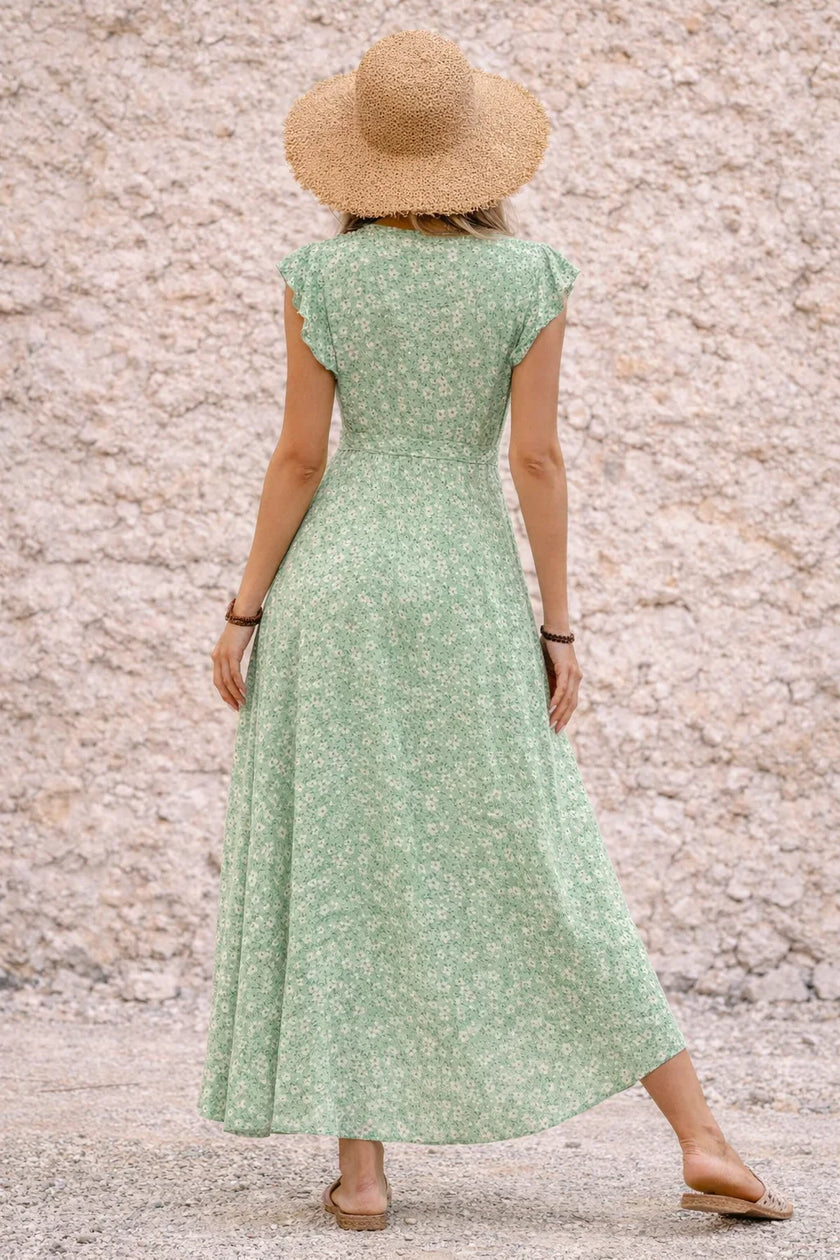 Sage green asymmetric dress by FJØRNA featuring a flowing silhouette and elegant drape, perfect for stylish occasions.