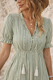Sage green bohemian maxi dress by FJØRNA featuring flowing fabric and relaxed fit, perfect for casual or boho-chic styles.