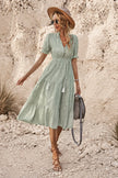 Sage green bohemian maxi dress by FJØRNA featuring flowing fabric and relaxed fit, perfect for casual or beachwear.