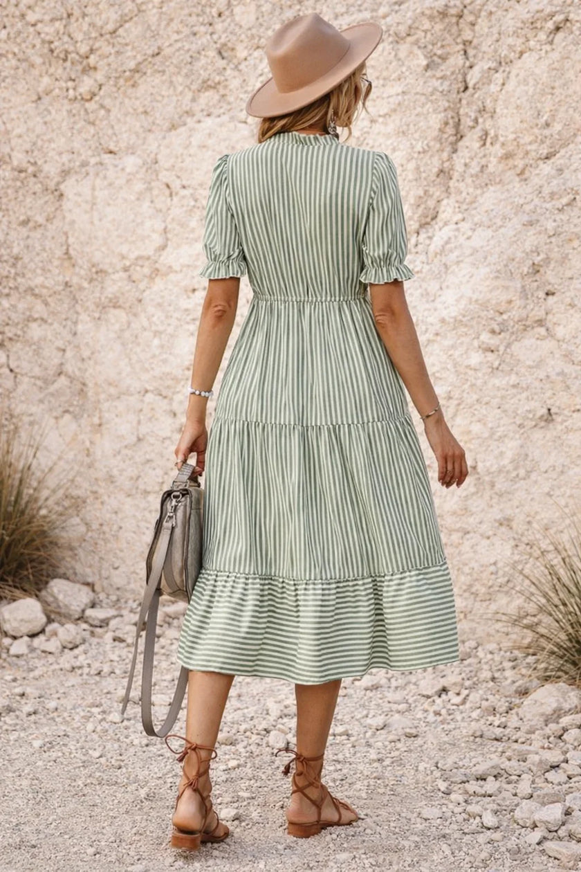 Sage green bohemian maxi dress by FJØRNA with flowing fabric and relaxed fit, perfect for casual or boho-inspired styles.