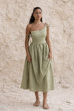Sage green boho maxi dress by FJØRNA with flowing fabric and relaxed fit, perfect for casual summer wear.