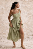 Sage green boho maxi dress by FJØRNA featuring flowing fabric, bohemian style, and a relaxed fit displayed on a model.