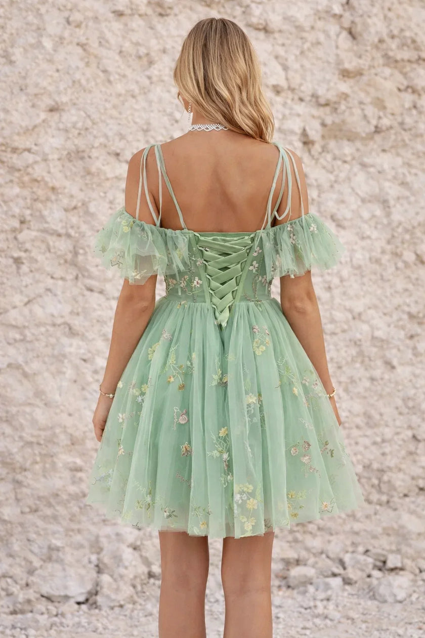 FJØRNA green sage bustier dress featuring a fitted bodice and elegant design, perfect for stylish and comfortable wear.