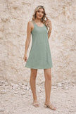 Sage green openwork knit dress for women by FJØRNA, featuring a lightweight, textured design and relaxed fit.