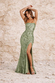 Sage green floral dress by FJØRNA with a flowy silhouette and delicate floral pattern, perfect for spring and summer occasions.