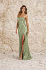 Sage green floral dress by FJØRNA, featuring a flowing design with floral patterns and long sleeves.
