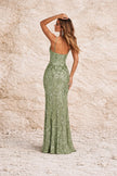 Sage green floral FJØRNA dress with a flowing, lightweight fabric and floral pattern, perfect for spring and summer wear.