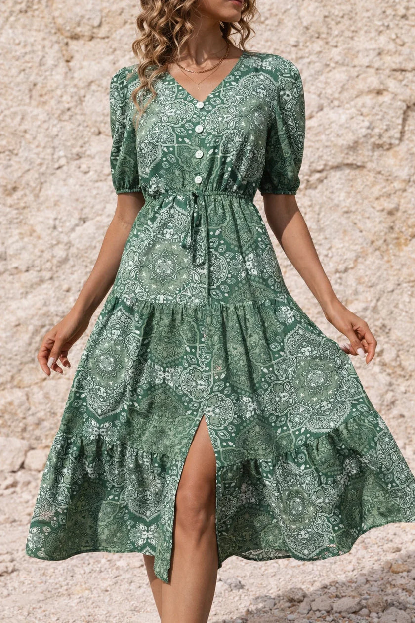 Sage green FJØRNA flowy dress with a relaxed fit, lightweight fabric, and elegant drape, perfect for casual or summer wear.