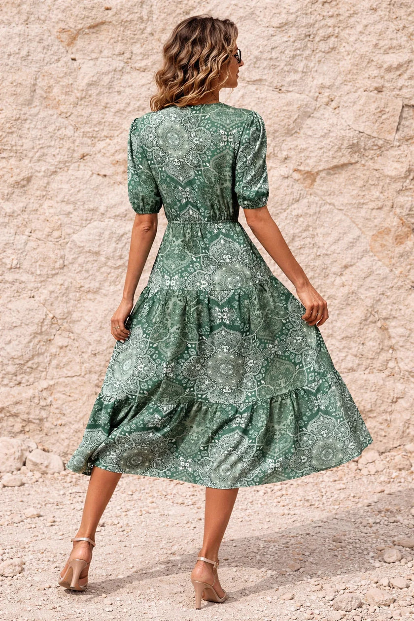 Sage green FJØRNA flowy dress with a lightweight, elegant fabric and relaxed fit, perfect for casual or semi-formal occasions.