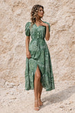 Sage green FJØRNA flowy dress with lightweight fabric, long sleeves, and a relaxed, elegant silhouette.
