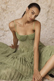 Sage green pleated midi dress from FJØRNA, featuring a flowy design and elegant pleats, perfect for stylish occasions.