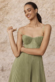 Sage green pleated midi dress by FJØRNA featuring a flowing silhouette and elegant pleats, perfect for stylish occasions.