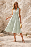 Sage green striped midi dress by FJØRNA featuring a flowing silhouette and elegant design, perfect for casual or semi-formal wear.